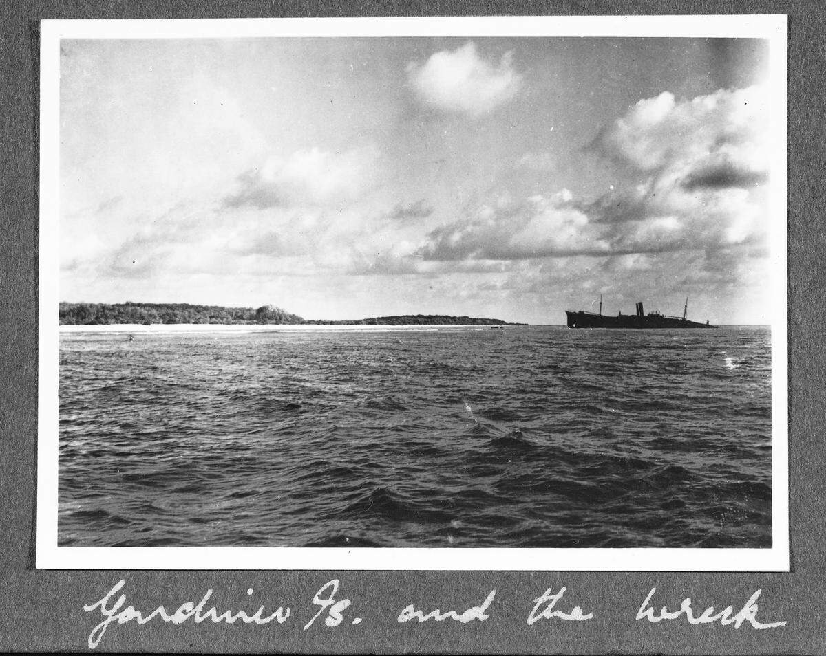 This image provided by The International Group for Historic Aircraft Recovery and displayed at a U.S. State Department news conference on Tuesday, March 20, 2012, may provide a new clue in one of the 20th century’s most enduring mysteries and could soon help uncover the fate of American aviator Amelia Earhart, who went missing without a trace over the South Pacific 75 years ago, investigators said. Enhanced analysis of a photograph taken just months after Earhart’s Lockheed Electra plane vanished shows what experts think may be the landing gear of the aircraft, the small black object on the left side of the image, protruding from the waters off the remote island of Nikumaroro, in what is now the Pacific nation of Kiribati. Armed with that analysis by the State Department, historians, scientists and salvagers from The International Group for Historic Aircraft Recovery, are returning to the island in July 2012 in the hope of finding the wreckage of Earhart’s plane and perhaps even the remains of the pilot and her navigator Fred Noonan. (AP Photo/The International Group for Historic Aircraft Recovery)
