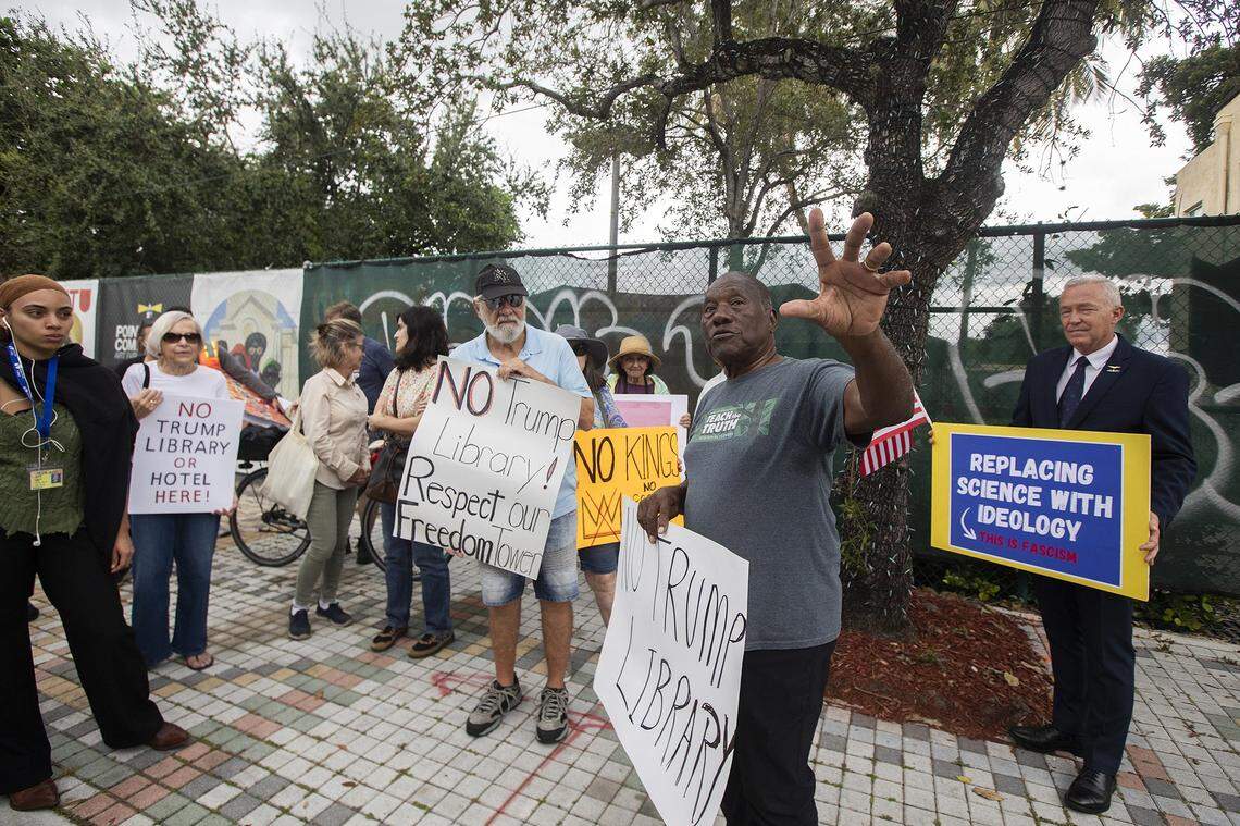 Activist and historian Marvin Dunn speaks with protesters outside the Kaseya Center during President Trump's appearance in Miami on Wednesday, Nov. 5, 2025. Demonstrators carried signs and chanted against his policies and a proposed land transfer for Trump's presidential library, raising concerns about public accountability and local institutions.