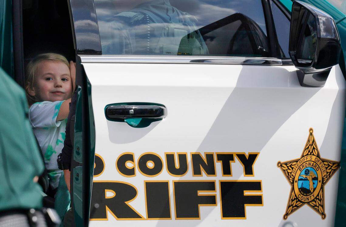 Seraphine Gingles, 4, sits safely inside a Broward Sheriff’s Office vehicle in a Walmart parking lot in North Lauderdale on Sunday, Feb. 16, 2025. She was the subject of an Amber Alert following the shooting deaths earlier that day of three people in Tamarac, including her mother Mary Gingles, her grandfather David Ponzer and their neighbor Andrew Ferrin. Seraphine’s father, Nathan Gingles, has been charged in the murders.