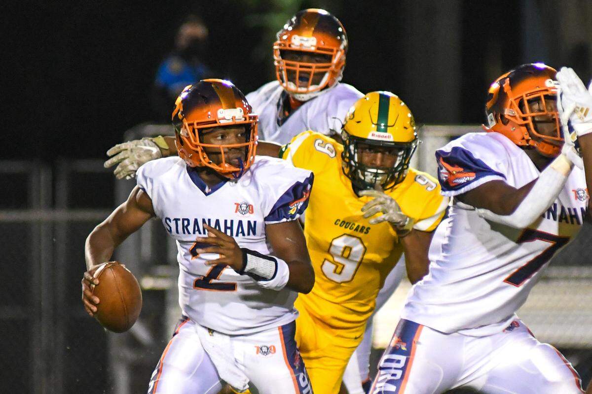 Stranahan quarterback Kenson Nelson (2) evades pressure from Killian defensive lineman Tyler Johnson (9) on Saturday, Dec. 5, 2020, at Traz Powell Stadium.