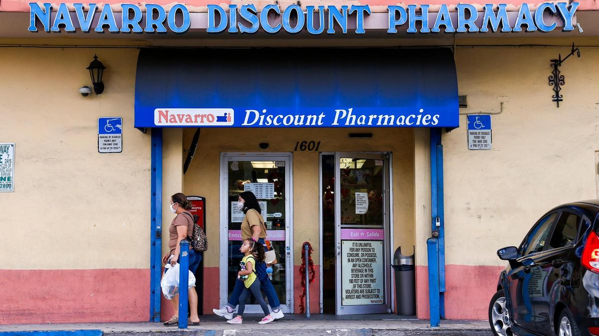 Shoppers exit Navarro Discount Pharmacy on 1601 W. Flagler St. in Miami, Florida, hours after the store was evacuated due to high levels of carbon monoxide on Saturday, February 12, 2022.