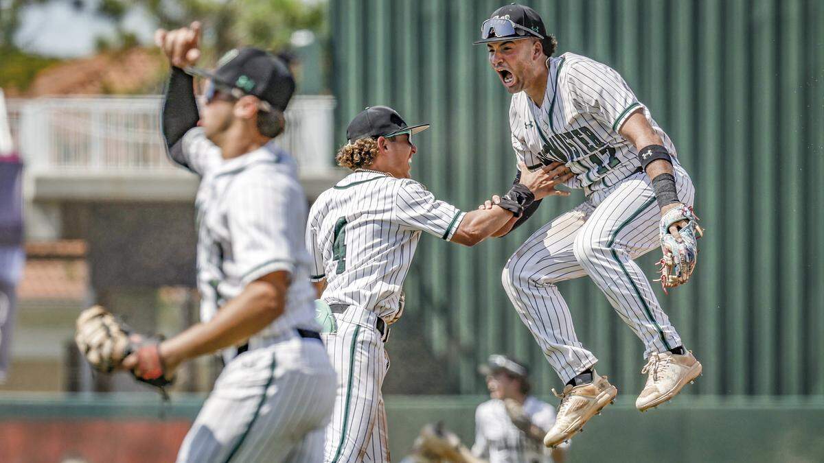 Westminster Christian School infielders William Alvarez (17) and Manny Marin (4) celebrate on the field after the Warriors defeat the Jacksonville Trinity Christian Conquerors during the FHSAA Baseball Class 3A State Semifinal at Hammond Stadium in Fort Myers, Florida on on Tuesday, May 21, 2024.