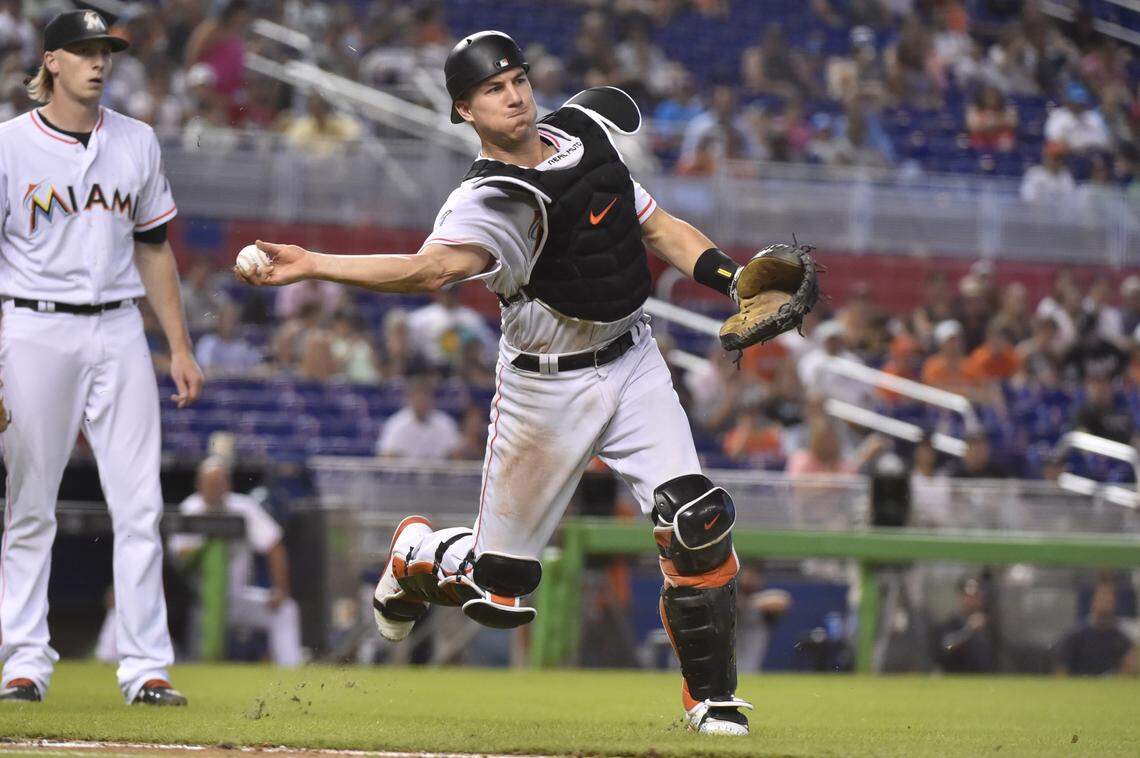 MIAMI, FL - JULY 15: J.T. Realmuto #11 of the Miami Marlins throws towards first base during the eighth inning against the Philadelphia Phillies at Marlins Park on July 15, 2018 in Miami, Florida. (Photo by Eric Espada/Getty Images)