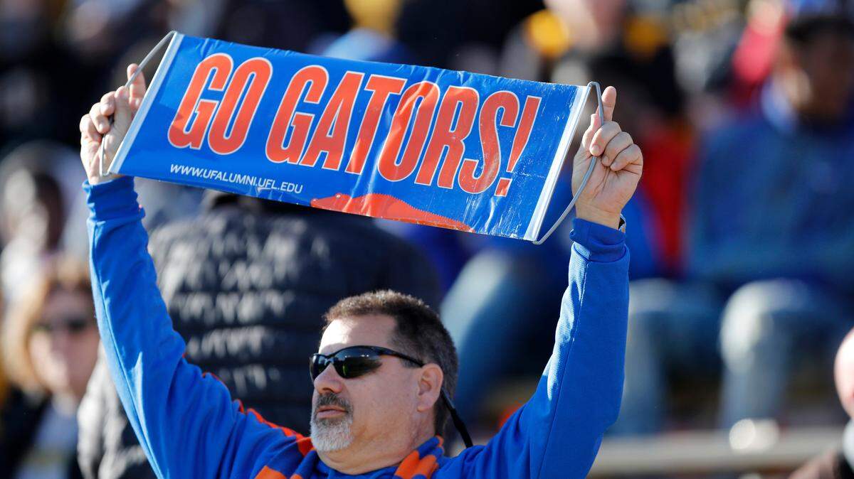 A Florida fan holds up a sign during the second half of an NCAA college football game between Missouri and Florida Saturday, Nov. 16, 2019, in Columbia, Mo. Florida won 23-6.