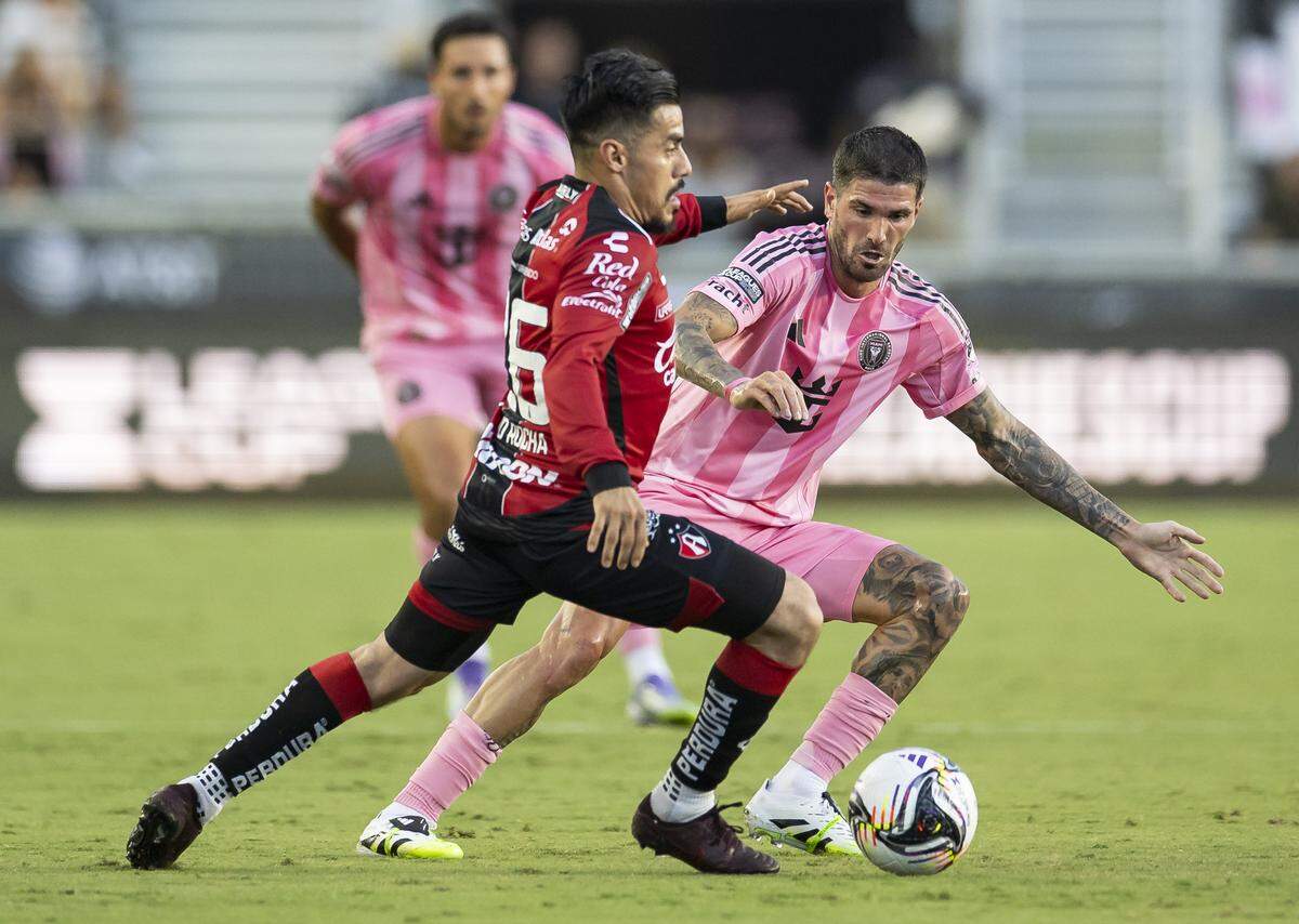 Inter Miami midfielder Rodrigo De Paul (7) defends as Atlas midfielder Aldo Rocha (26) looks to pass the ball in the first half of their Leagues Cup Phase One soccer match at Chase Stadium on Wednesday, July 30, 2025, in Fort Lauderdale, Fla.