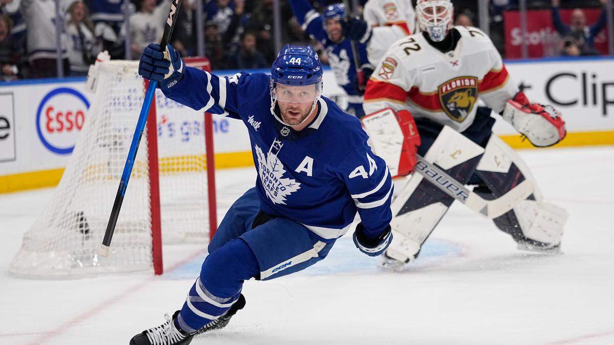 May 5, 2025; Toronto, Ontario, CAN; Toronto Maple Leafs defenseman Morgan Rielly (44) celebrates scoring against Florida Panthers goaltender Sergei Bobrovsky (72) during the first period of the second round of the 2025 Stanley Cup Playoffs at Scotiabank Arena. Mandatory Credit: John E. Sokolowski-Imagn Images