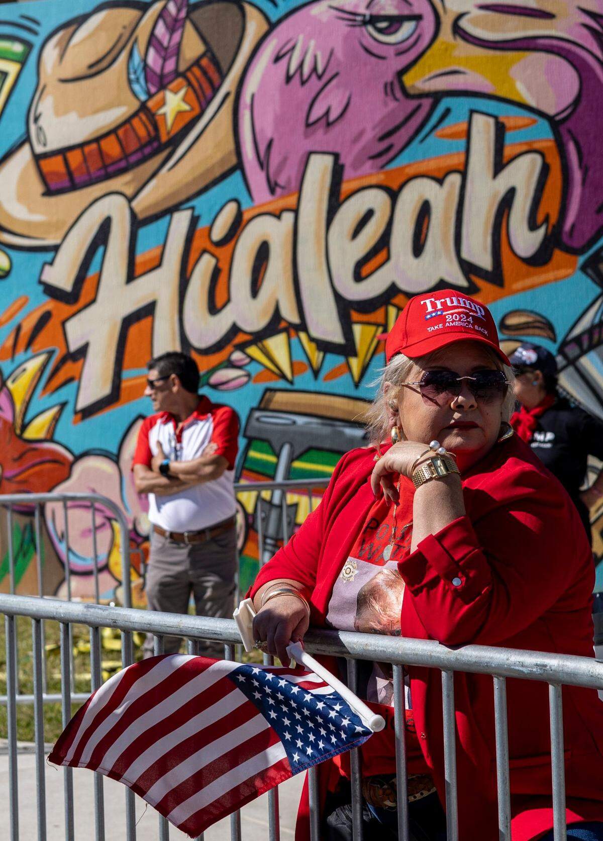 Marlen Alvarez, from Pembroke Pines waits patiently under the hot sun to get into the rally.