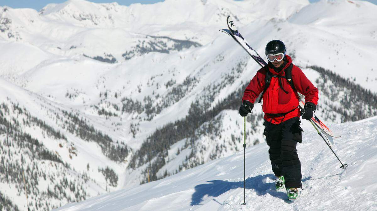 SILVERTON, CO - MARCH 12: Snowsport enthusiest Danny Wishard of Salt Lake City, Utah climbs toward the summit to ski Silverton Mountain on March 12, 2010 in Silverton Colorado. Silverton Mountain is a unique experience offering guided back country skiing to a summit of more than 13,000' serviced by one chairlift that accesses terrain that is entirely for the advanced and expert skiers. (Photo by Doug Pensinger/Getty Images)