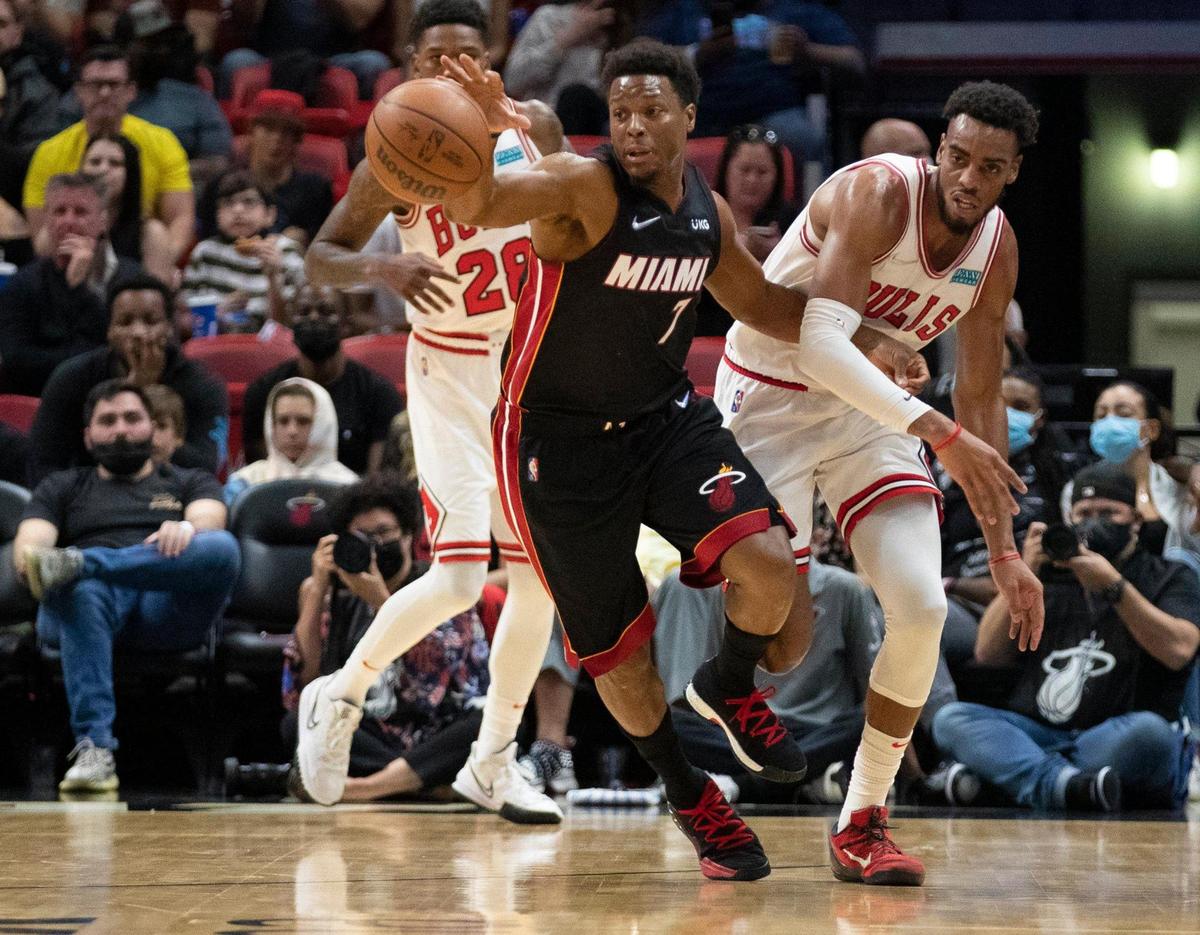 Miami Heat guard Kyle Lowry (7) steals the ball from Chicago Bulls forward Troy Brown Jr. (7) in the first quarter at the FTX Arena in Miami on Saturday, December 11, 2021.