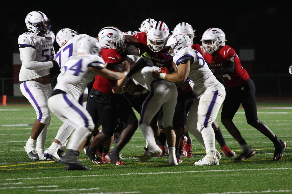 Chaminade’s defense stuffs a run by True North during its 56-0 win over the Titans in the Class 1M state semifinals on Friday night.