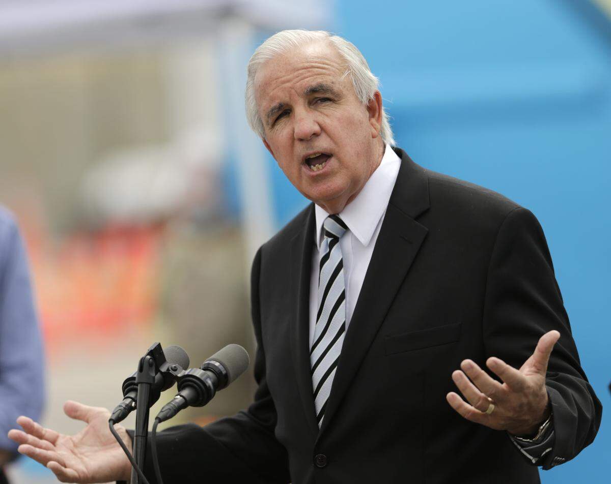 Miami-Dade County Mayor Carlos Gimenez rebuffed the proposed straw poll, saying the county does not have legal authority to conduct health screenings on its own.