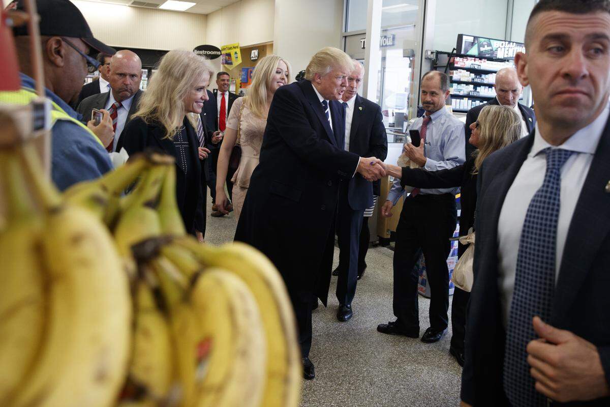 In this file photo, President Donald Trump, when he was on the campaign trail, talked with customers during a visit to a Wawa gas station, Tuesday, Nov. 1, 2016, in King of Prussia, Pennsylvania.