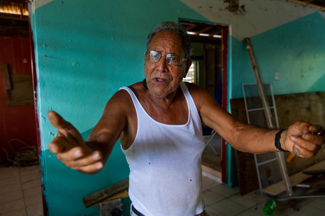 Roberto Rivera Rosario, 75, stands below a temporary roof in the second story of his rain damaged home on August 24, 2018. Rivera Rosario’s home in Barriada Bitumur in San Juan, Puerto Rico was severely damaged by Hurricane Maria.