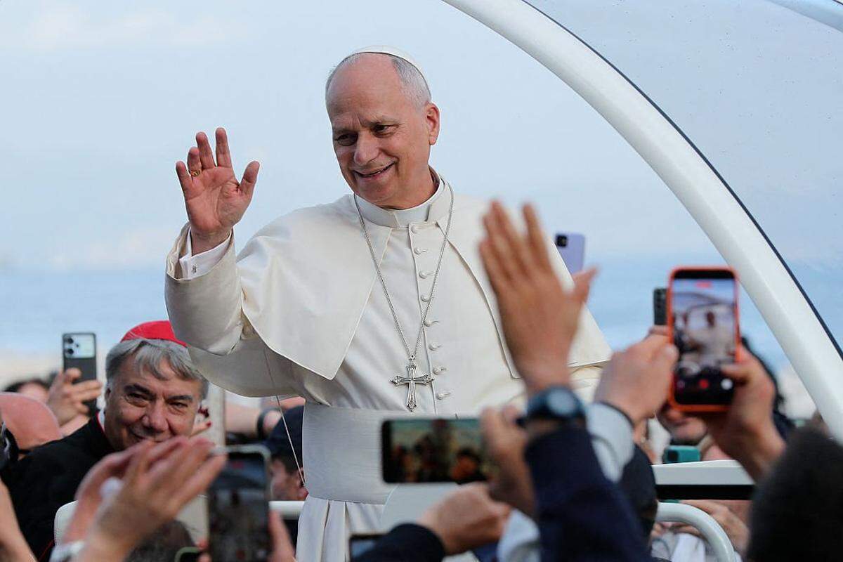 Pope Leo XIV waves to the crowd from the popemobile at the end of a pastoral visit in Naples on May 8, 2026. (Photo by Carlo Hermann / AFP via Getty Images)