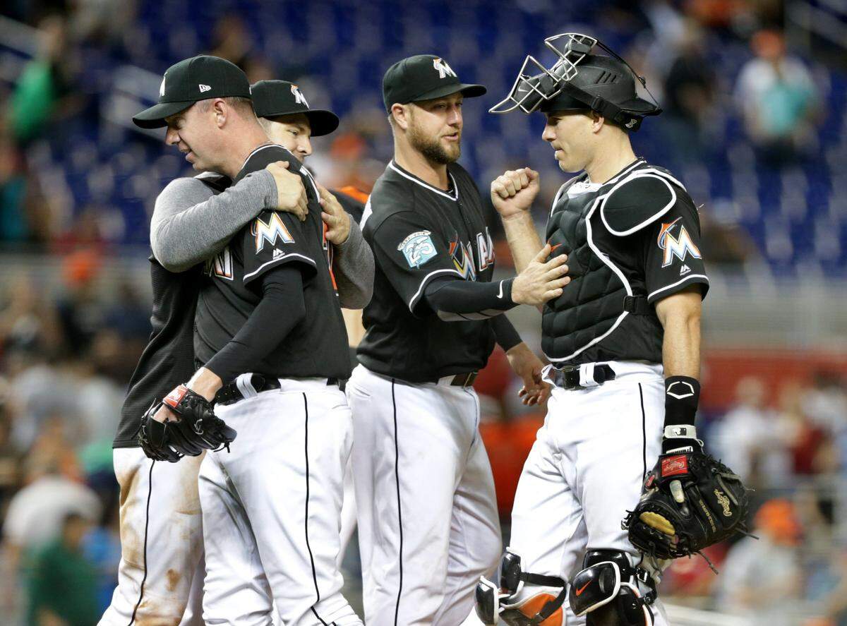 Marlins greeted catcher J.T. Realmuto and pitcher Brad Ziegler as they celebrate their 6-3 victory against the Atlanta Braves game at Marlins Park, Friday, May 11, 2018.