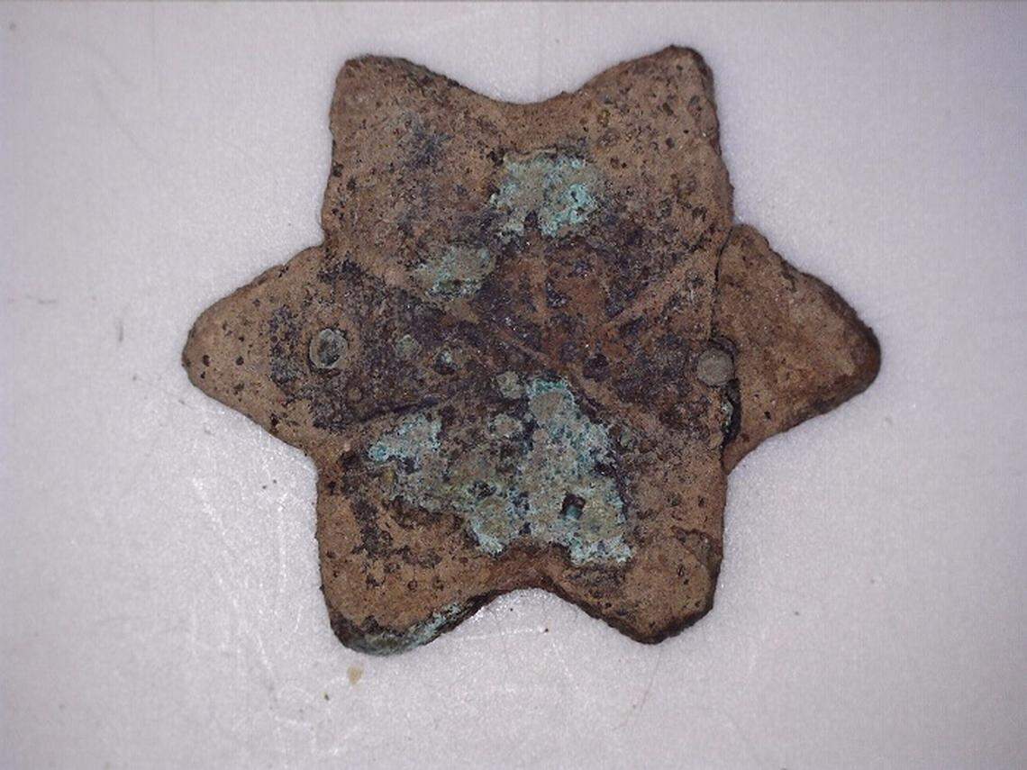 Part of a copper belt found at the site.