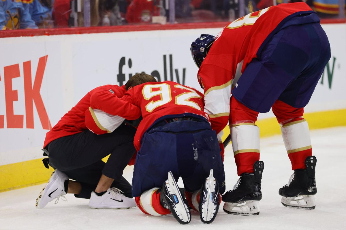 Florida Panthers left wing Tomas Nosek (92) is checked on by a trainer after a collision against the boards during the first period of an NHL preseason game against the Nashville Predators at Amerant Bank Arena in Sunrise, Florida, on Sunday, September 22, 2024.