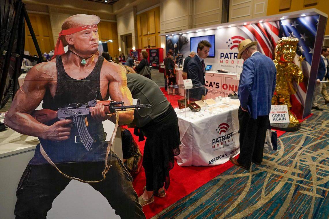 A cardboard cutout of Donald Trump is seen at a booth at a trade show at the Conservative Political Action Conference (CPAC) Friday, Feb. 25, 2022, in Orlando, Fla.