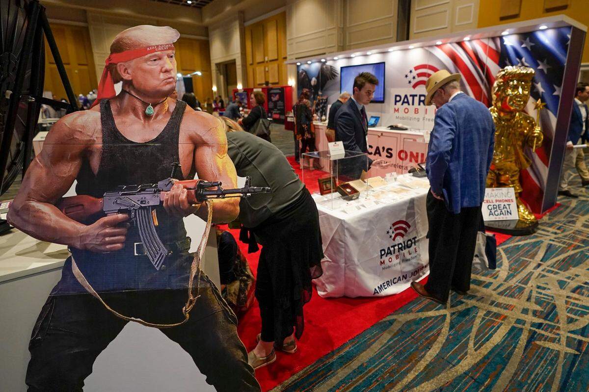 A cardboard cutout of Donald Trump is seen at a booth at a trade show at the Conservative Political Action Conference (CPAC) Friday, Feb. 25, 2022, in Orlando, Fla.