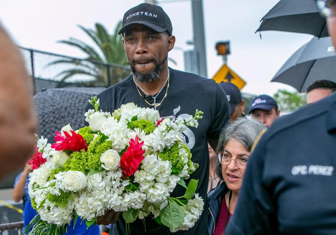 Miamii-Dade County Mayor Daniella Levine Cava and the Miami Heat’s Udonis Haslem visited the memorial wall for the missing people in the collapsed Champlain Towers South condo, located at 8777 Collins Avenue in Surfside, on Wednesday, June 30, 2021.
