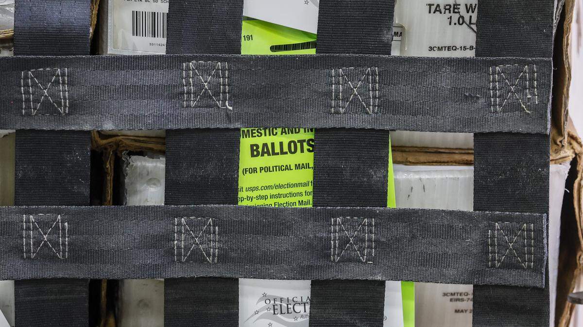 Carts full of vote-by-mail ballots are loaded onto a USPS truck at the Miami-Dade Supervisor of Elections Office in Doral, Florida, on Thursday, March 19, 2026.