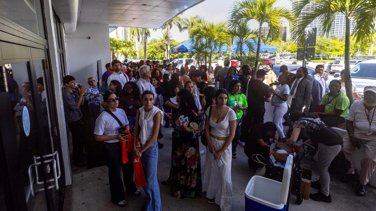 Members of the public, many opposing the city of Miami entering with an agreement with ICE, wait for their turn to speak during Tuesday’s commission meeting.