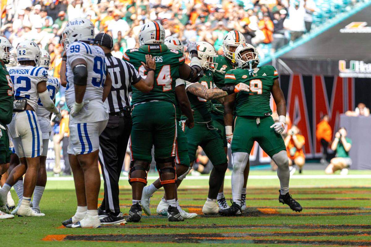 Miami Hurricanes tight end Elija Lofton (9) reacts with teammates after scoring a touchdown during the second half of an ACC football game against the Duke Blue Devils at Hard Rock Stadium on Saturday, Nov. 2, 2024, in Miami Gardens, Fla.