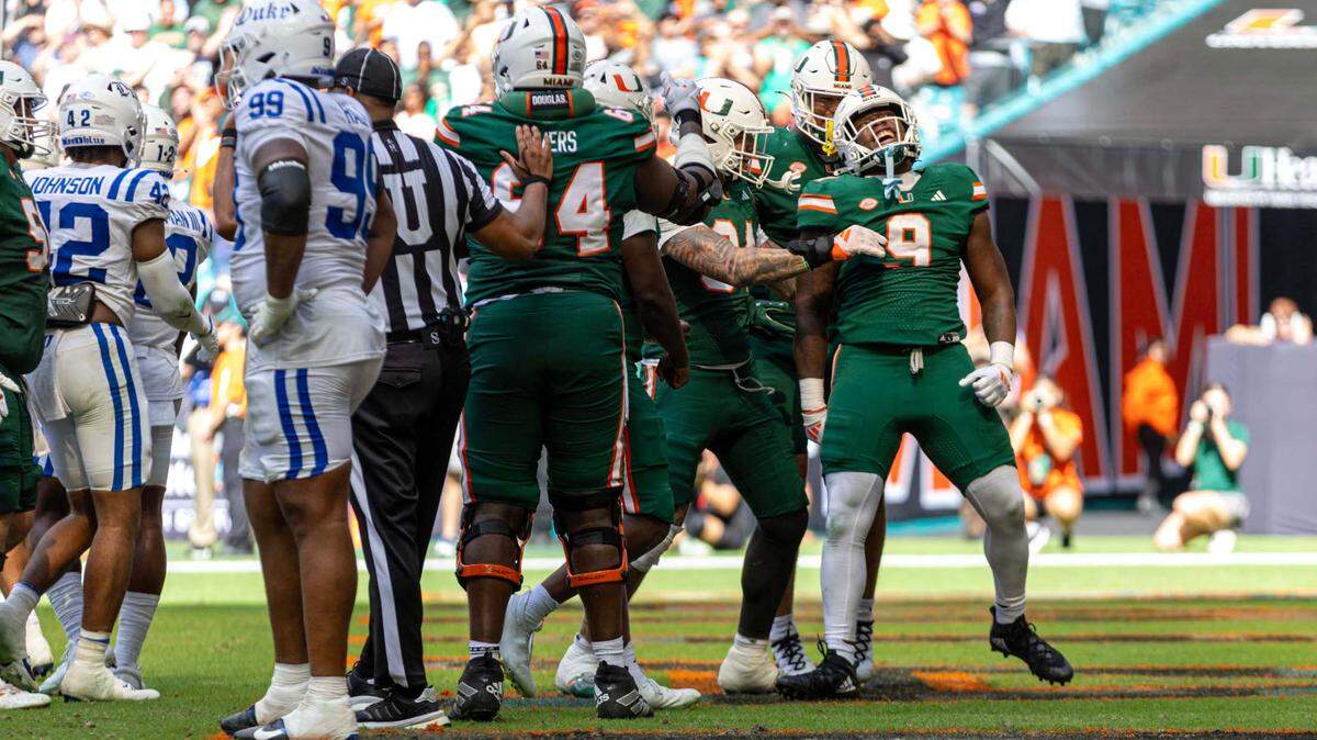 Miami Hurricanes tight end Elija Lofton (9) reacts with teammates after scoring a touchdown during the second half of an ACC football game against the Duke Blue Devils at Hard Rock Stadium on Saturday, Nov. 2, 2024, in Miami Gardens, Fla.