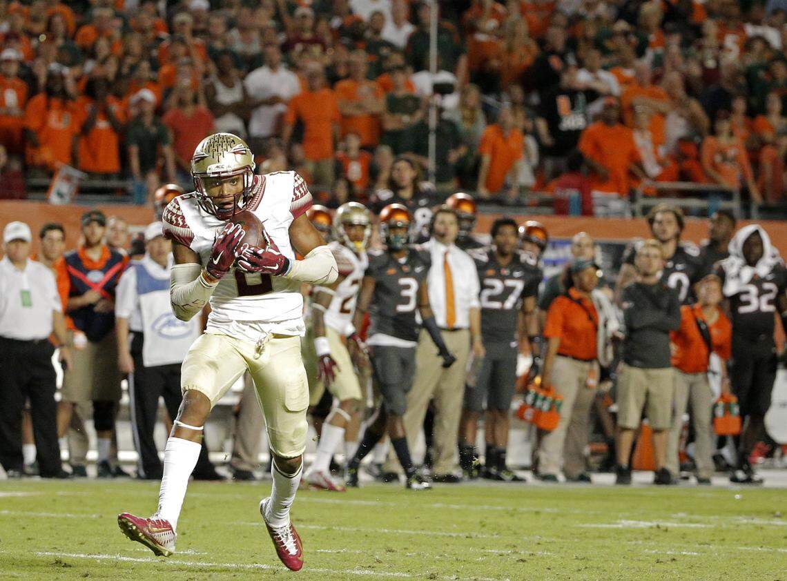 Florida State Seminoles defensive back Jalen Ramsey (#8) makes the game-ending interception against the Miami Hurricanes in the fourth quarter at SunLife Stadium in Miami Gardens on Sunday, November 16, 2014.