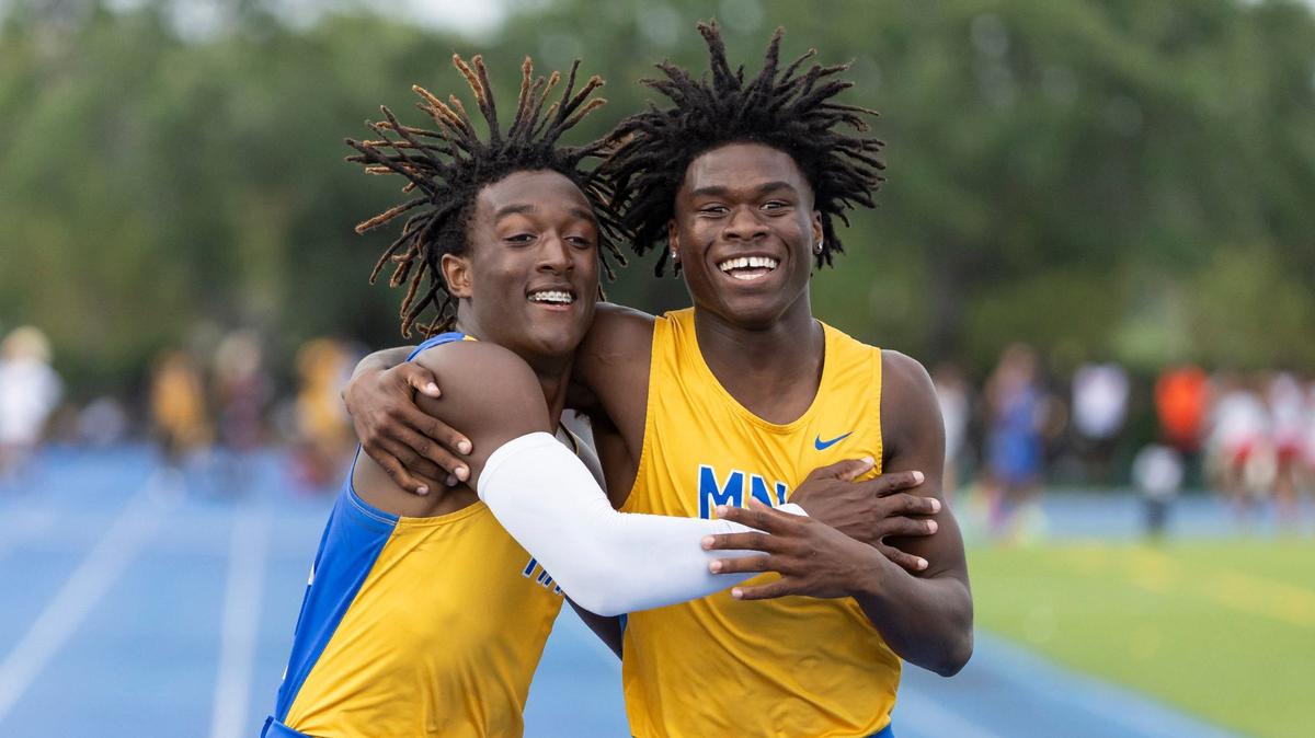 Tywan Cox, left, and J’Vari Flowers, both from Miami Northwestern Senior High, celebrate after competing in the boys 200 meter dash during the GMAC track and field championships at the Traz Powell Stadium on Thursday, April 11, 2024, in Miami, Fla. Cox won the race and Flowers finished second.
