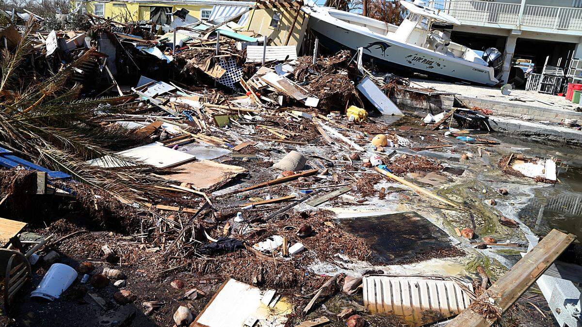 A boat sits next to a debris-covered canal on Saturday, Sept. 16, 2017. after Hurricane Irma made its way through Big Pine Key. The body of 77-year-old Big Pine Key resident James Donald Schlake was recently identified. He drowned during the storm. 