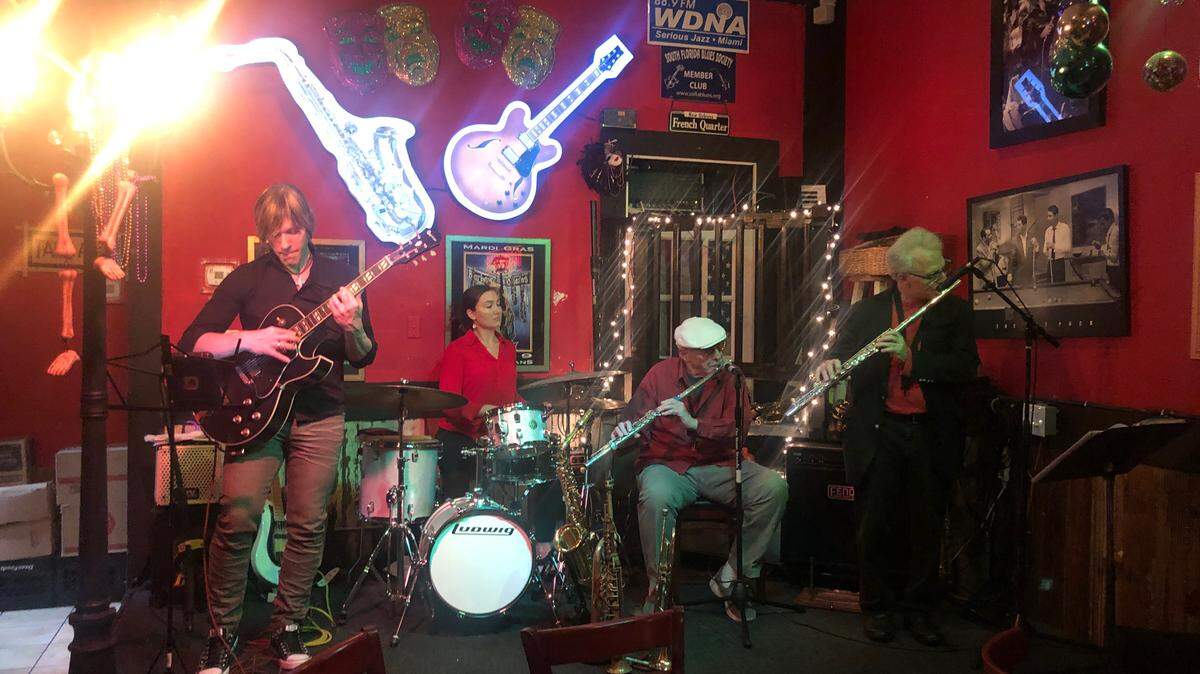 Since stay-at-home orders took effect, many local musicians found their gigs canceled. Angela Rivera at The Fish House started the BackroomLive Miami Cats Go Fund Me page to help those in need. Before the coronavirus pandemic, this jazz band played regular gigs. The musicians include Brev Sullivan, guitar; Emily Maddox, drums; Ira Sullivan, flute; and Marc Berner, flute.