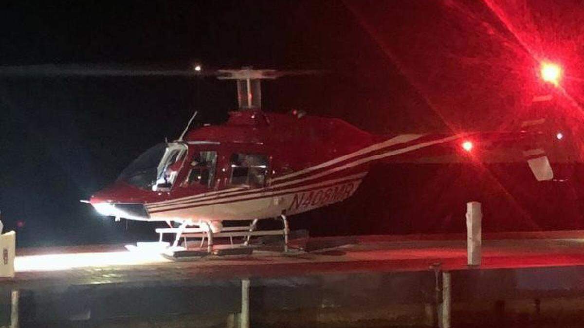 A helicopter lands at a Key Largo hotel Monday night, Feb. 24, 2020.