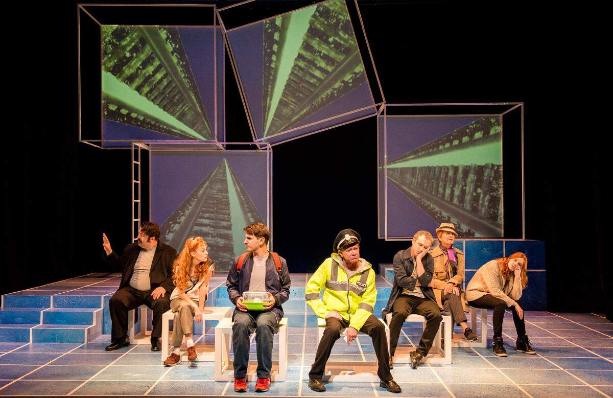 Ryan Didato’s Christopher, third from left, makes a frantic journey to London in Zoetic Stage’s ‘The Curious Incident of the Dog in the Night-Time.’