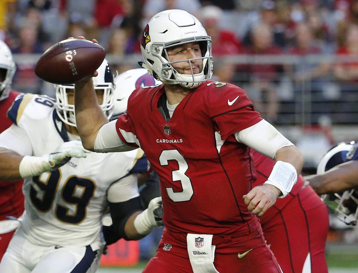 Arizona Cardinals quarterback Josh Rosen (3) looks to throw against the Los Angeles Rams during the first half of an NFL football game, Sunday, Dec. 23, 2018, in Glendale, Ariz.