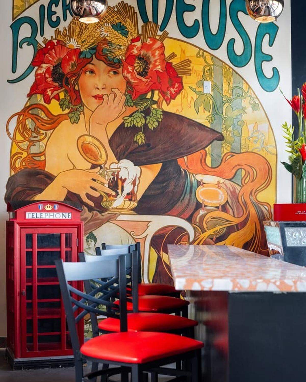 A mural replica of one of Alphonse Mucha’s works at Ostrow Brasserie.