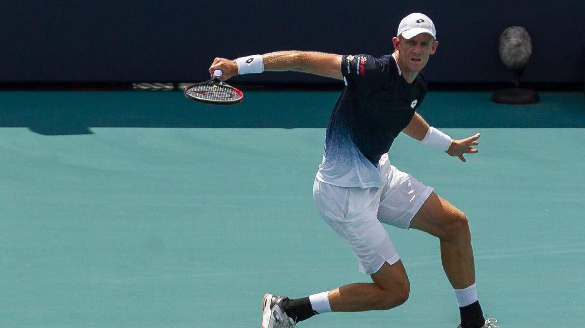 Kevin Anderson, of South Africa, returns a shot to Joao Sousa, of Portugal, during their match at the Miami Open tennis tournament on Monday, March 25, 2019 at Hard Rock Stadium in Miami Gardens.