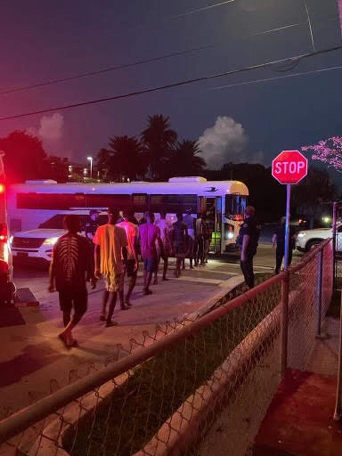 A group of Haitian migrants boards a bus in Key West Wednesday morning, June 26, 2024.