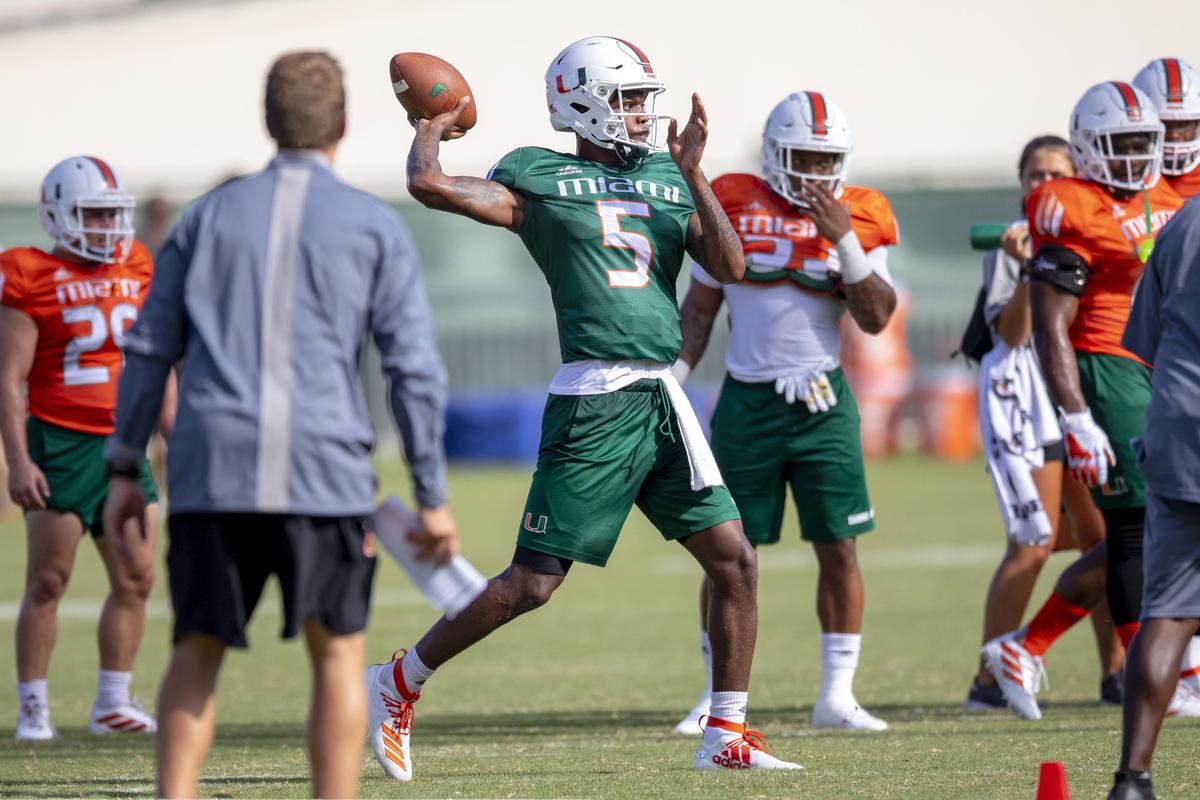 Miami Hurricanes redshirt sophomore quarterback N’Kosi Perry (5) sets up to throw during the University of Miami’s Fall practice at Greentree Field in Coral Gables on Sunday, July 28, 2019.