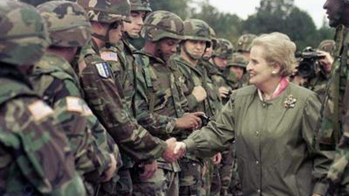 In 1998, U.S. Secretary of State Madeleine Albright shakes hands with U.S. soldiers during her visit to Air Base Eagle near Tuzla, Bosnia.