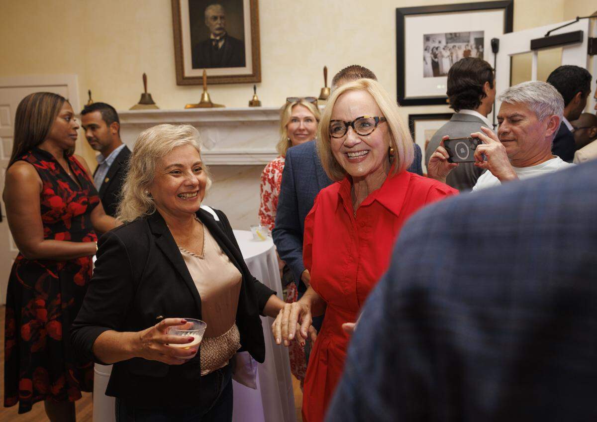 Mayor-elect Eileen Higgins, center, walks through the crowd after winning the runoff on Tuesday, Dec. 9, 2025, at the Miami Women's Club.