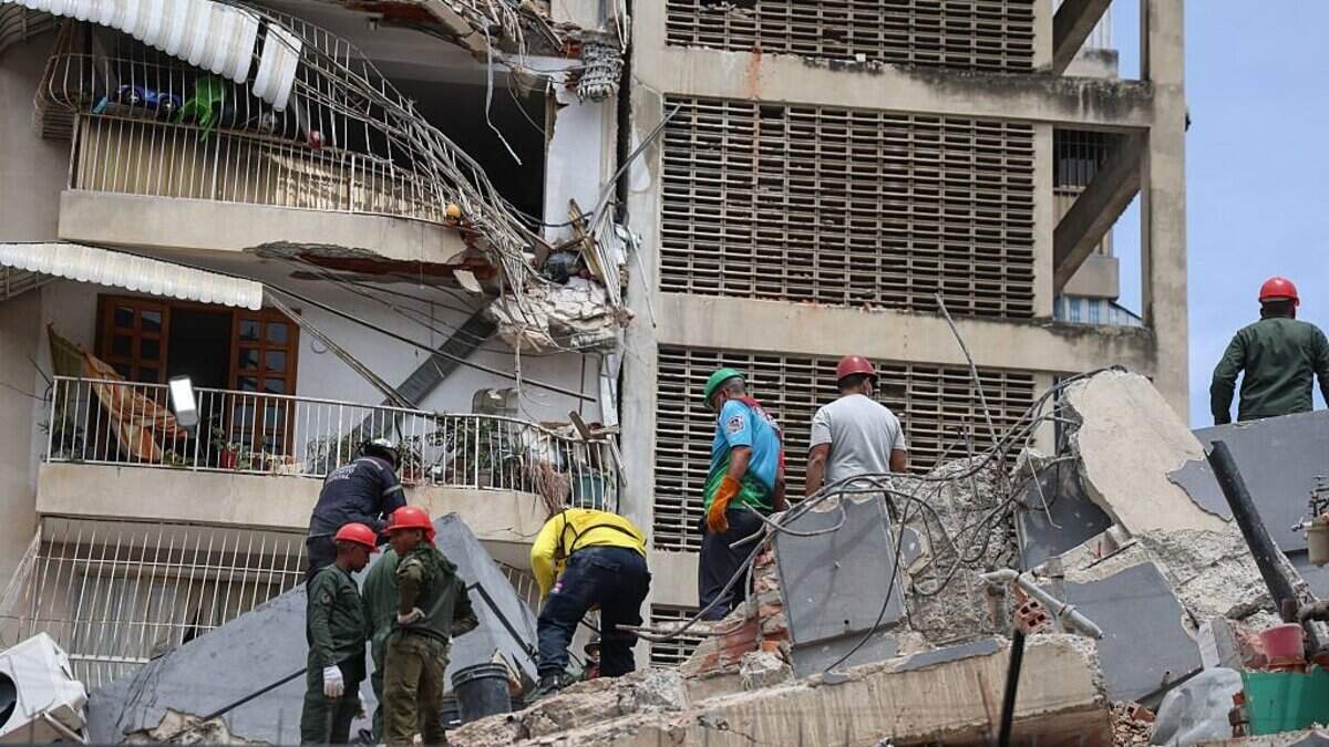 CARACAS, VENEZUELA - JUNE 25: People and rescuers work on the debris of a collapsed building after a magnitude 7.2 earthquake struck Venezuela and other regions in the Caribbean on June 25, 2026 in Caracas, Venezuela. According to the U.S. Geological Survey (USGS), the main earthquake was followed by a 7.5-magnitude aftershock less than a minute later. The number of victims increased to 164 and over a thousand injured. (Photo by Edilzon Gamez/Getty Images)