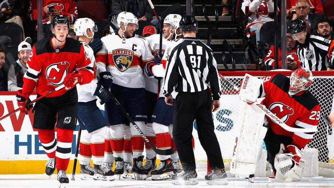 NEWARK, NEW JERSEY - NOVEMBER 09: The Florida Panthers celebrate a second period goal by Aleksander Barkov #16 against Mackenzie Blackwood #29 of the New Jersey Devils at the Prudential Center on November 09, 2021 in Newark, New Jersey. (Photo by Bruce Bennett/Getty Images)