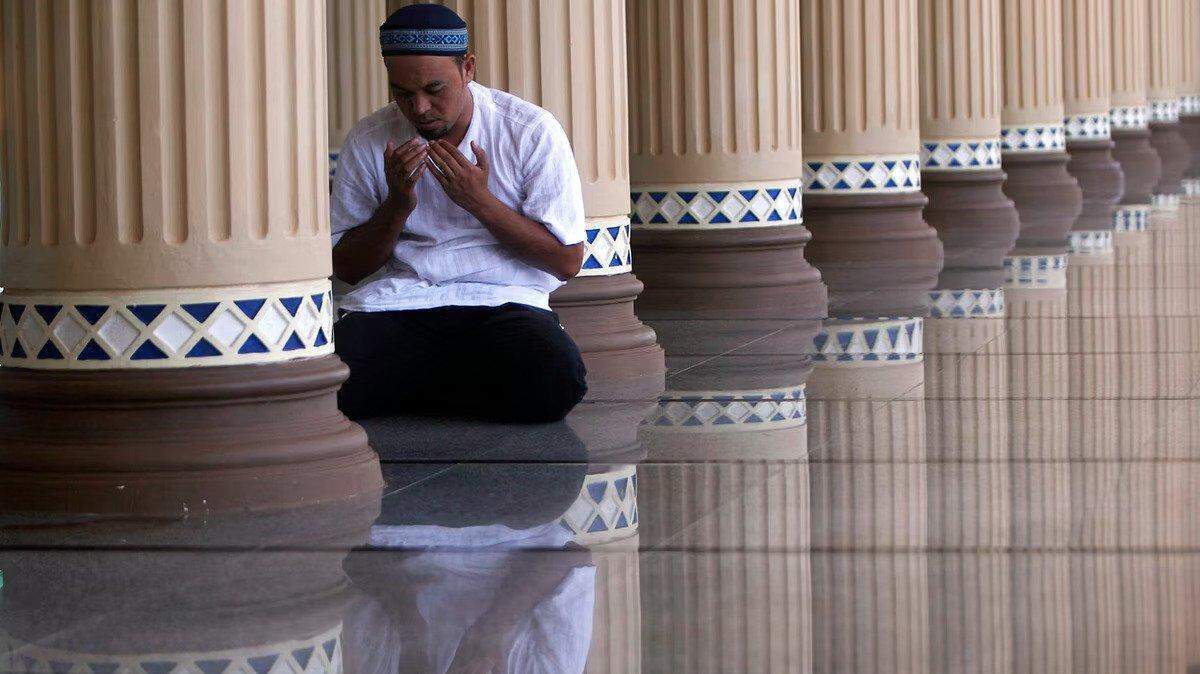 A Muslim man prays at Baiturrahman Grand Mosque in Banda Aceh, Indonesia in 2011.