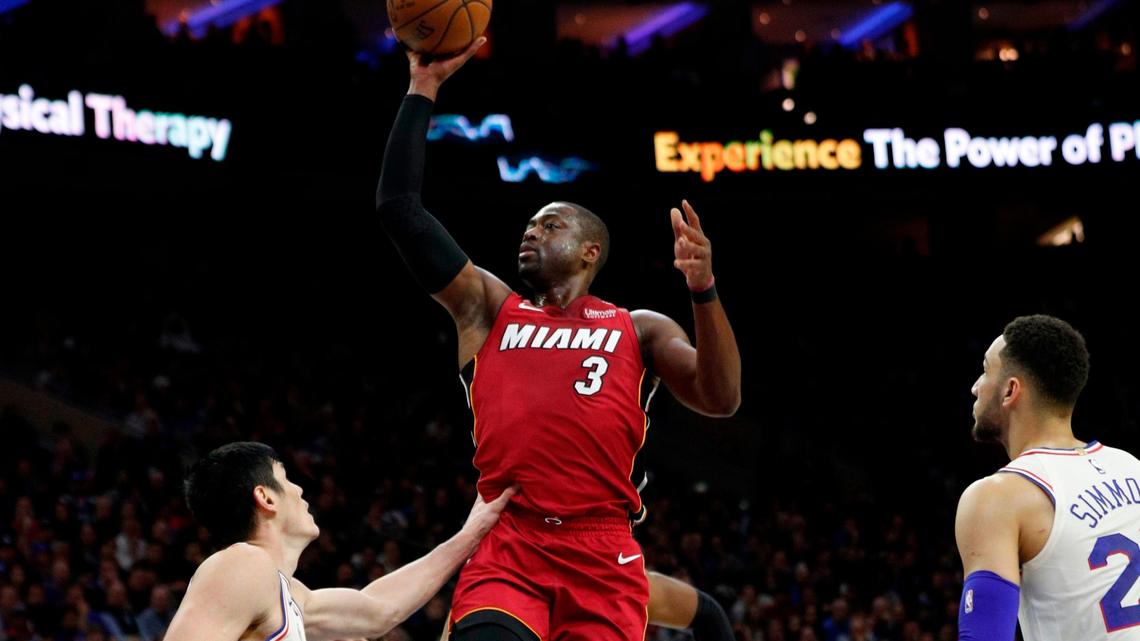 The Heat’s Dwyane Wade soars to the basket for two of his team-leading 28 points off the bench as the 76ers’  T.J. McConnell, center, and Ersan Ilyasova defend during the first half of Game 2 on Monday night in Philadelphia.