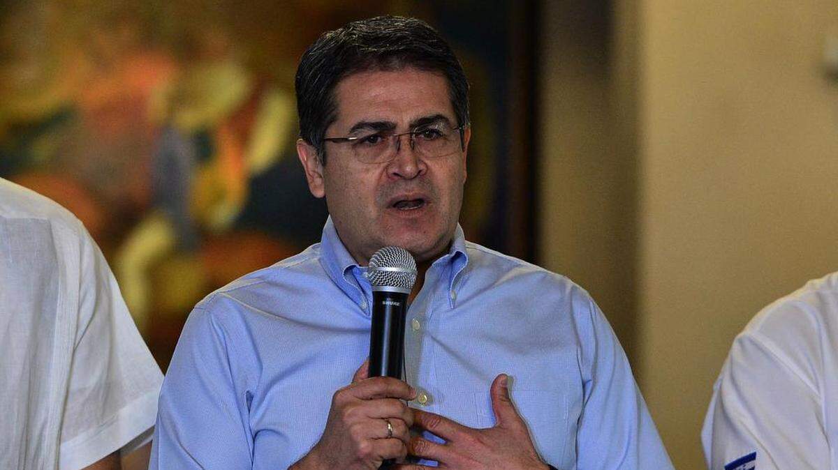 In this file photo Honduran President Juan Orlando Hernández speaks at a press conference at the presidential palace in Tegucigalpa on Oct. 18, 2019. 