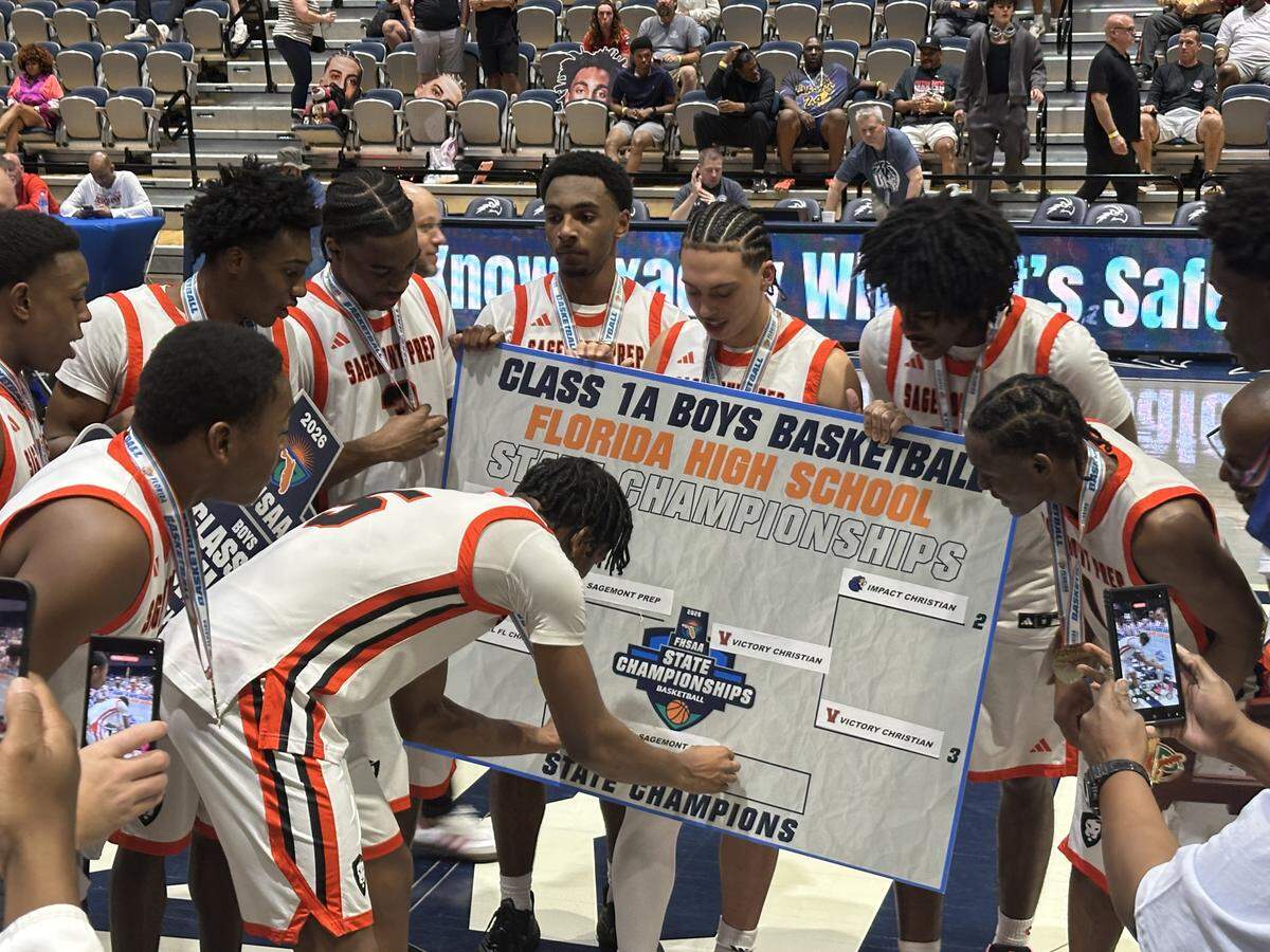 Sagemont’s Obinna Ekufu places his school’s name on the Class 1A state championship bracket after the Lions beat Lakeland Victory Christian on Saturday night at UNF Arena in Jacksonville, Fla. to secure their fourth consecutive state championship.