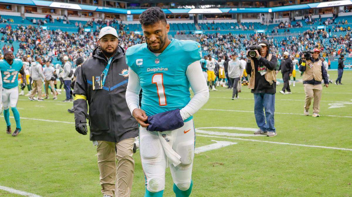 Miami Dolphins quarterback Tua Tagovailoa (1) walks off the field after the Green Bay Packers defeat the Dolphins at Hard Rock Stadium in Miami Gardens, Florida on Sunday, December 25, 2022.