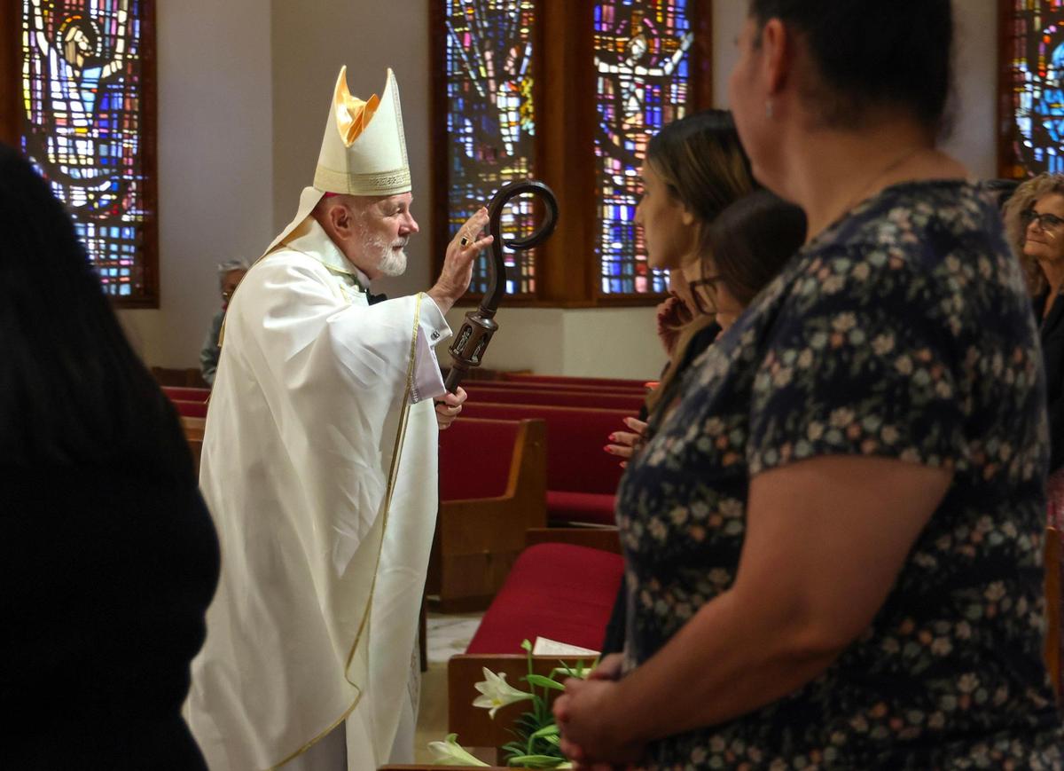Archbishop Thomas Wenski blesses worshipers while exiting after offering the first of the traditional nine Masses offered for the repose of the soul of Pope Francis at the Church of St. Martha on April 21, 2025, in Miami Shores, Florida.&nbsp;&nbsp;