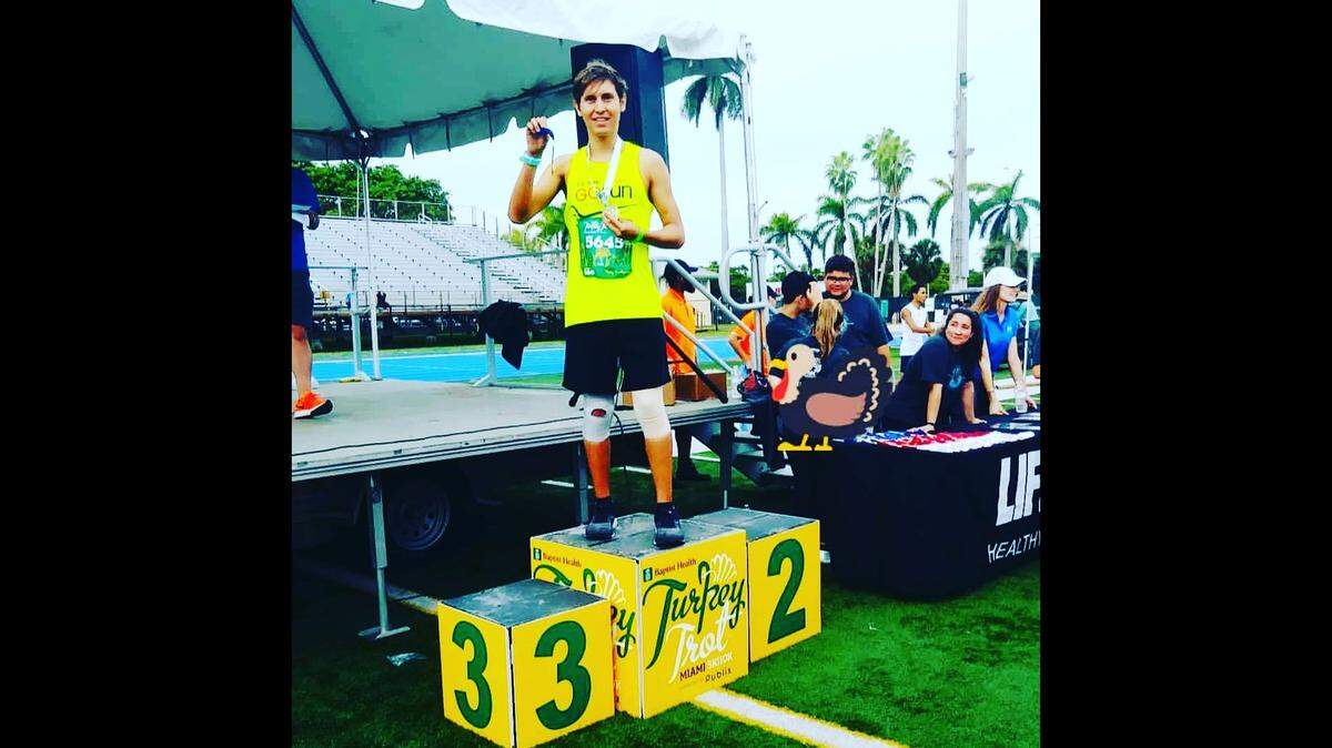 Sebastian Perez posed with his medal after running in the Turkey Trot in Tropical Park last year. He developed bulimia, an eating disorder, while in high school and received treatment at an eating disorder clinic in West Palm Beach. He will be running in this year’s Turkey Trot on Thanksgiving Day.